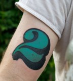 typographic tattoo green  number on arm