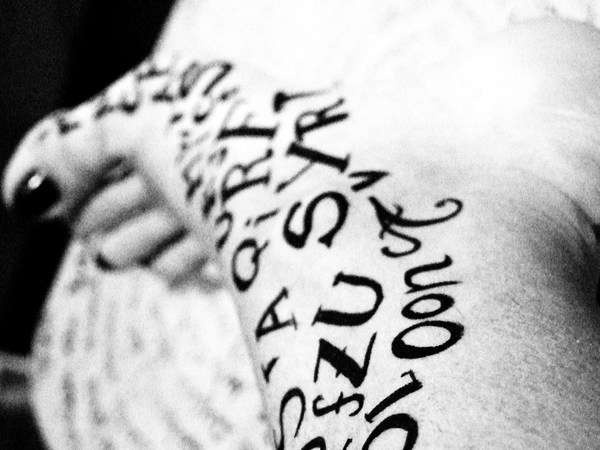 typographic tattoo on foot love letters by aliona micher