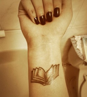 Arm book tattoo