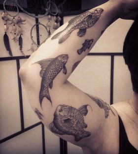 Arm fishes tattoo