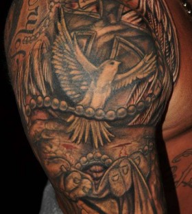 Bird religious tattoo