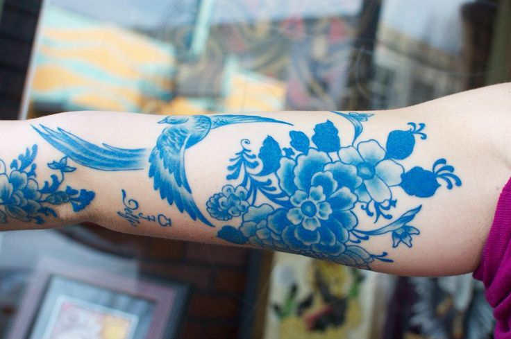 Birds and flowers blue tattoo