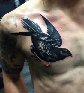 Black bird tattoo by Pari Corbitt