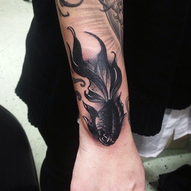 Black fish tattoo by Pari Corbitt