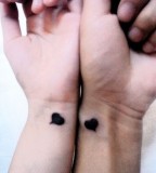 Black heart couples tattoo
