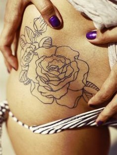 Black rose hip tattoo