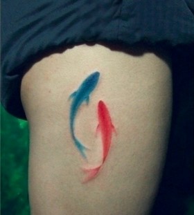 Blue and red fish tattoo