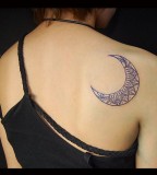 Blue moon tattoo on women back