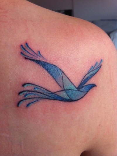 Blue simple bird tattoo