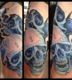 Blue skull tattoo by Michael Norris