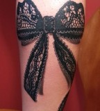 Bow lace tattoo