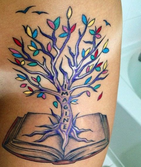 Colorful tree and book tattoo