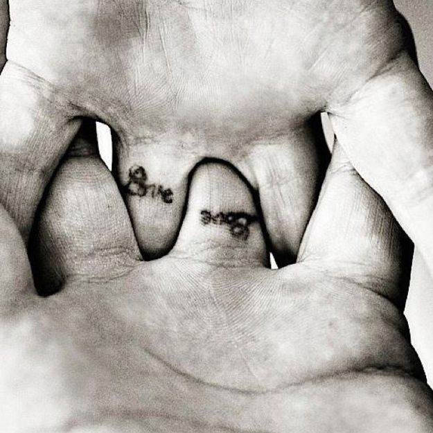 Couple love fingers tattoo