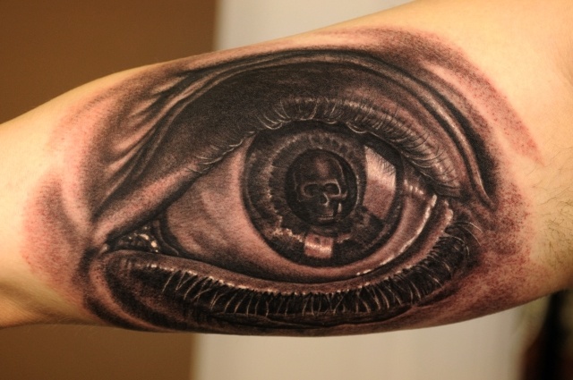 Eyes and skull tattoo by Andy Engel