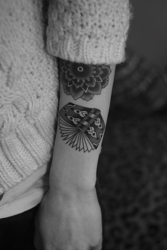 Flowers and book tattoo