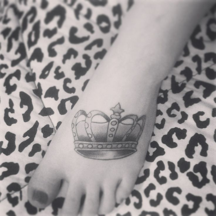 Foot black and white crown tattoo
