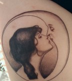 Girl and moon kiss tattoo