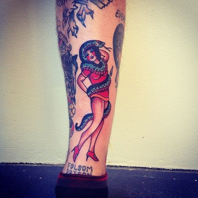 Girl and snake tattoo by Kirk Jones