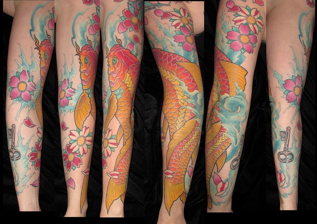 Gold fish tattoo by Michael Norris