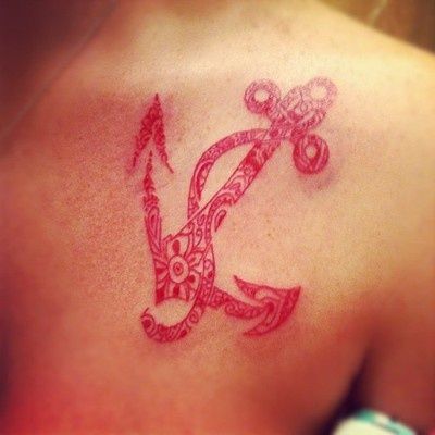 Great looking red inchor tattoo