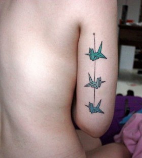 Green birds origami tattoo