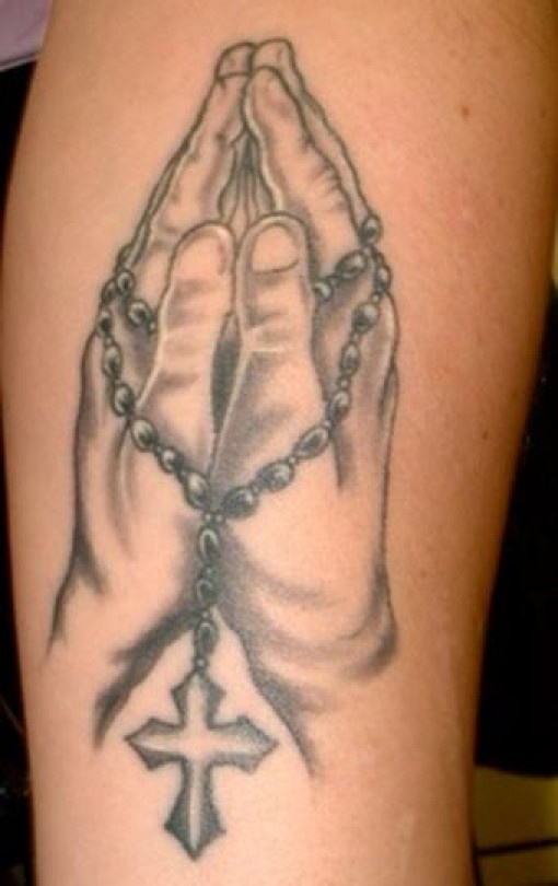 Hands religious tattoo