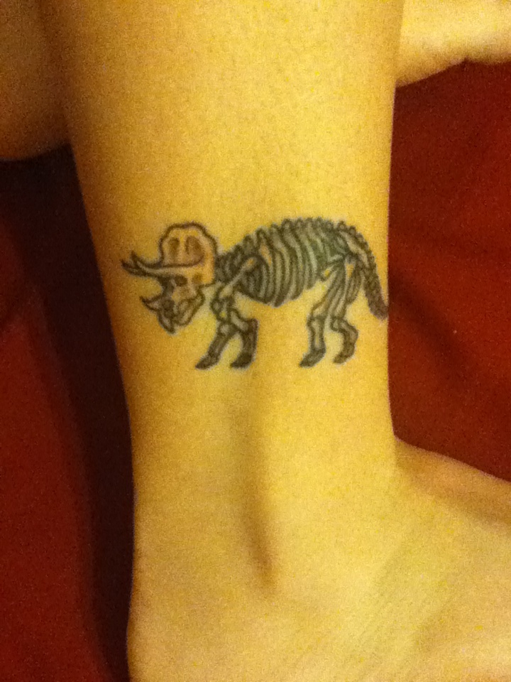 Leg dinosaur tattoo