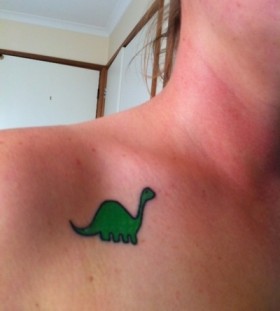 Lovely green dinosaur tattoo