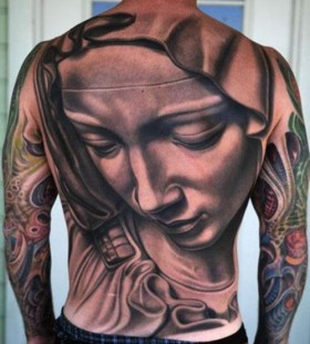 Man religious tattoo