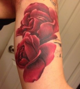 Realistic rose red tattoo