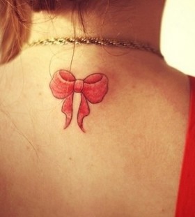 Red bow tattoo