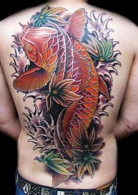 Red fish tattoo on man back