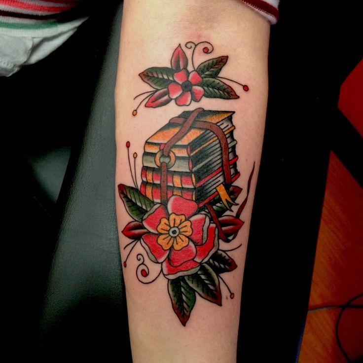 Red flowers and book tattoo