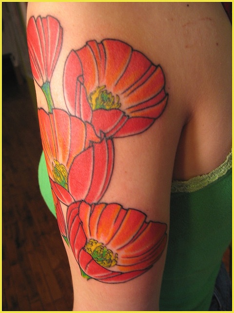 Red flowers tattoo