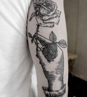 SV.A tattoo hand holding rose