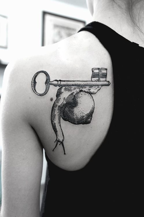 SV.A tattoo key and snail