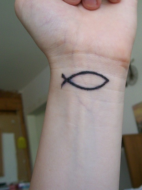 Simple fish tattoo