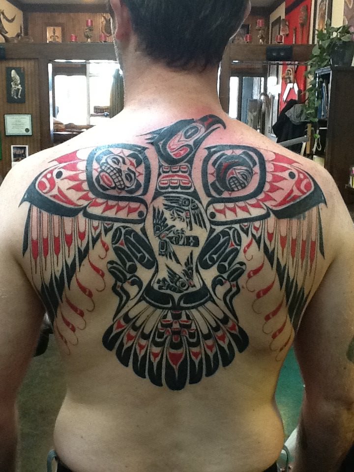 SirLexi Rex tattoo black and red bird on back