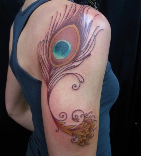 SirLexi Rex tattoo feather on arm