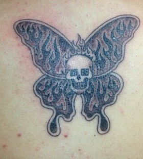 Skull and butterfly tattoo by Duane