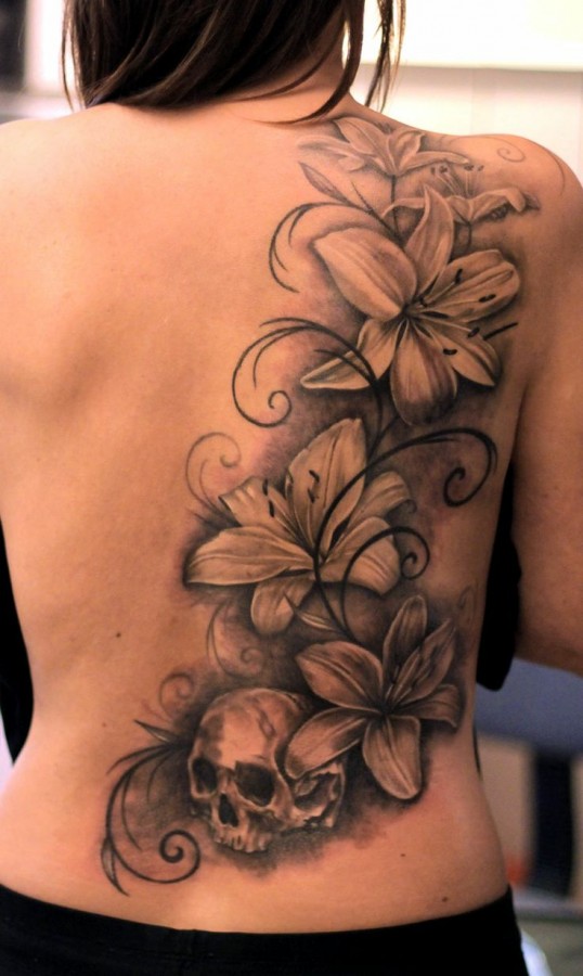 Skull and flowers back tattoo