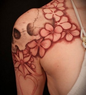 Skull and flowers tattoo by Meathshop