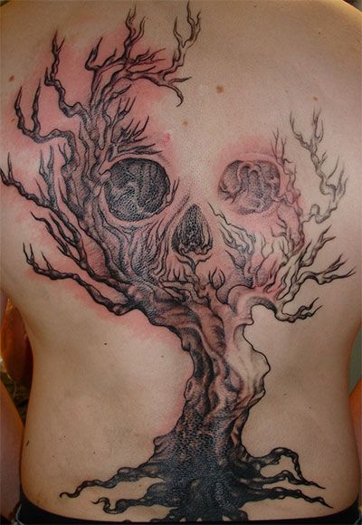 Skull and tree scary tattoo