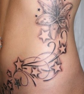 Stars and flowers hip tatoo