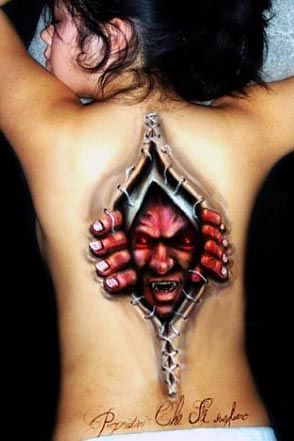 Wicked back scary tattoo