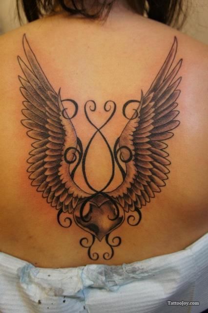 Wings from ornaments tattoo
