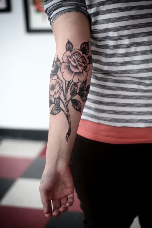 alice carrier rose tattoo on inside arm