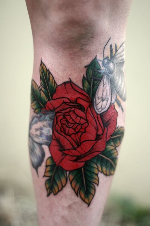 alice carrier tattoo big red flower under knee