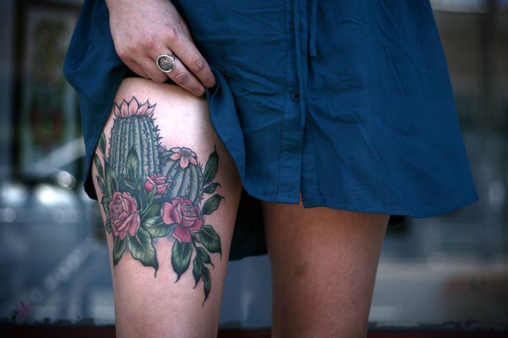 alice carrier tattoo cactus on leg