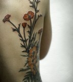 alice carrier tattoo red poppies on back